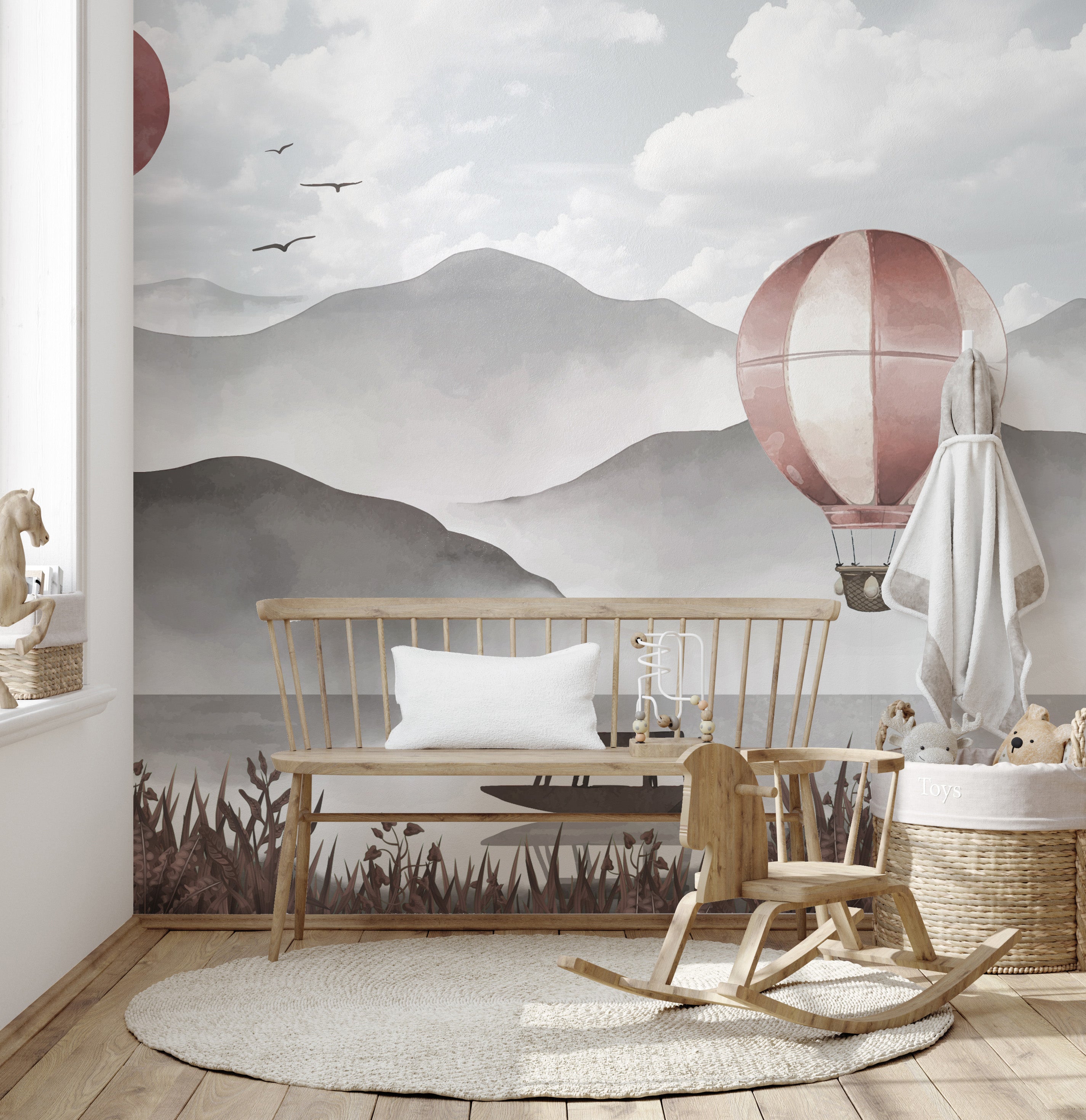 Adventure awaits with misty peaks and balloon mural