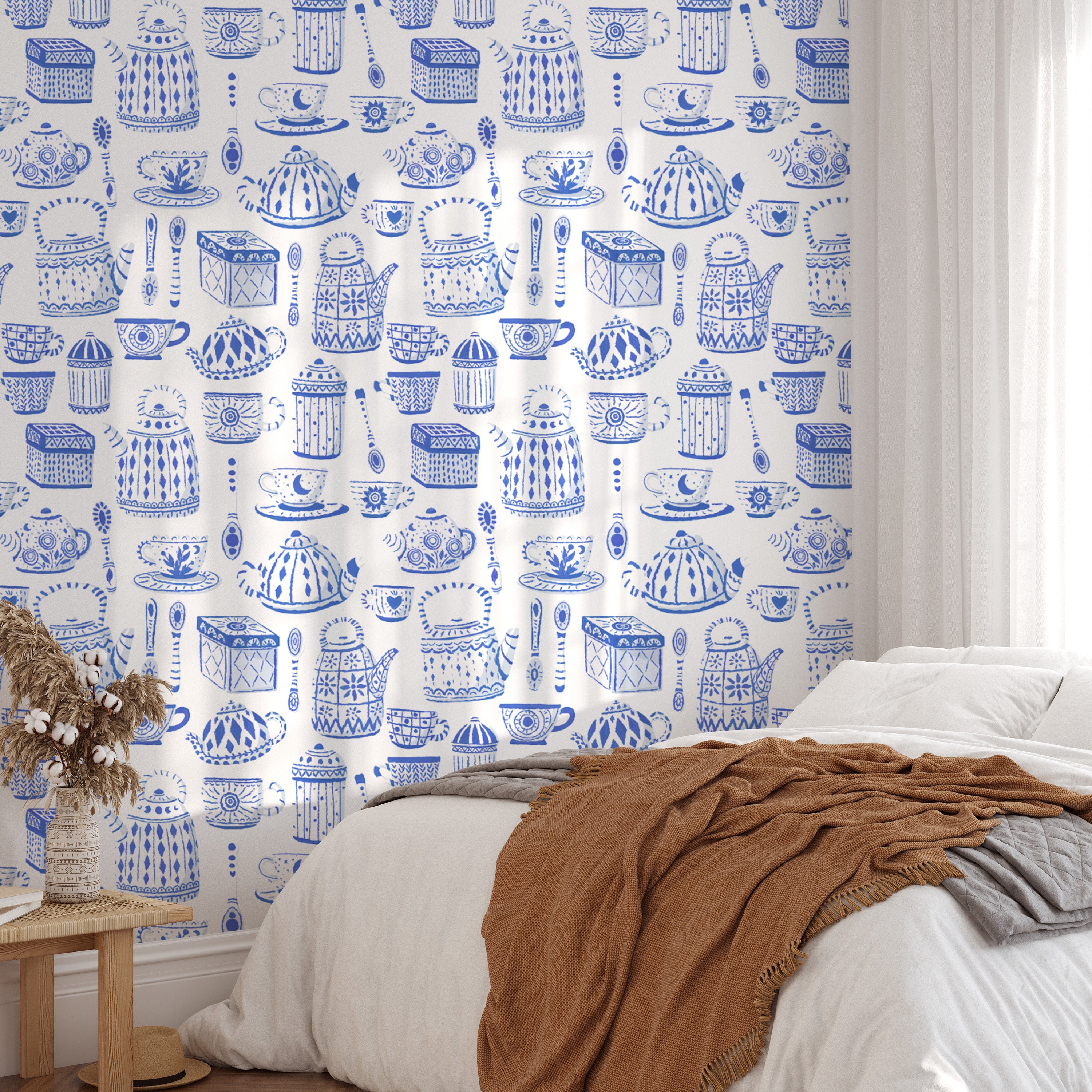 Charming tea set wallpaper with a soothing blue backdrop.
