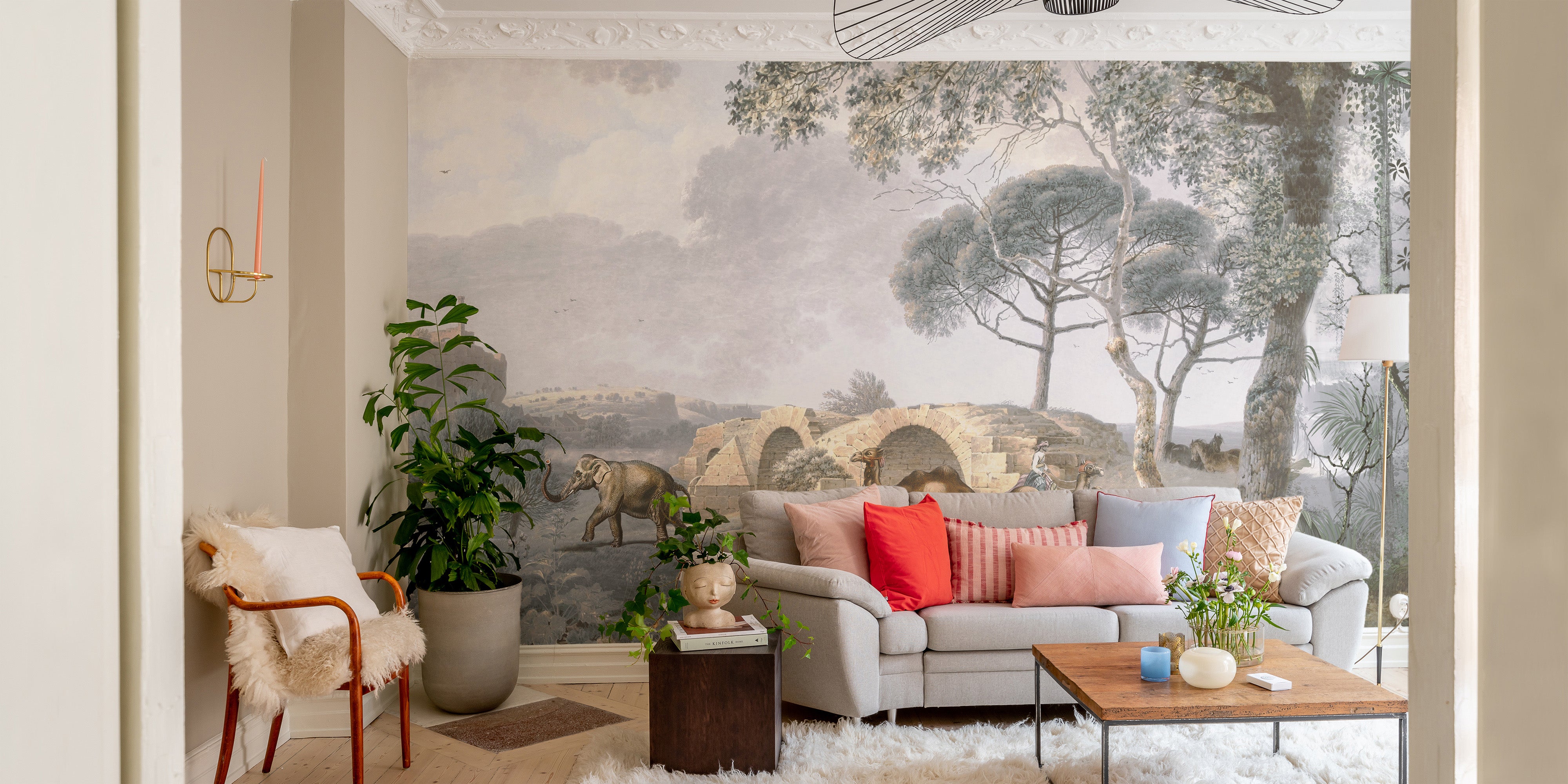 Serene garden view mural showcasing camels and birdlife.
