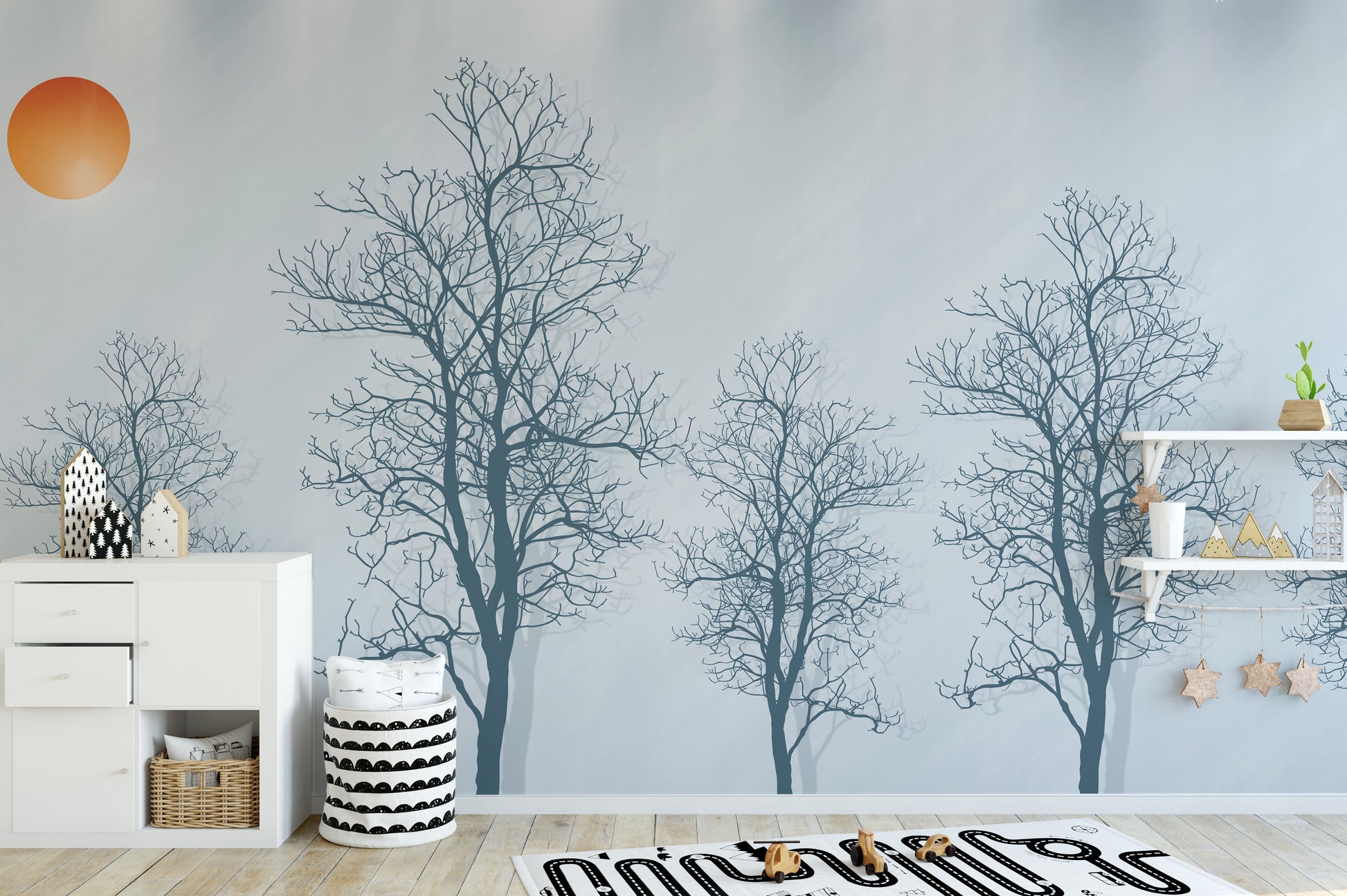 Bold wallpaper mural with tree silhouettes and a vivid red sun.
