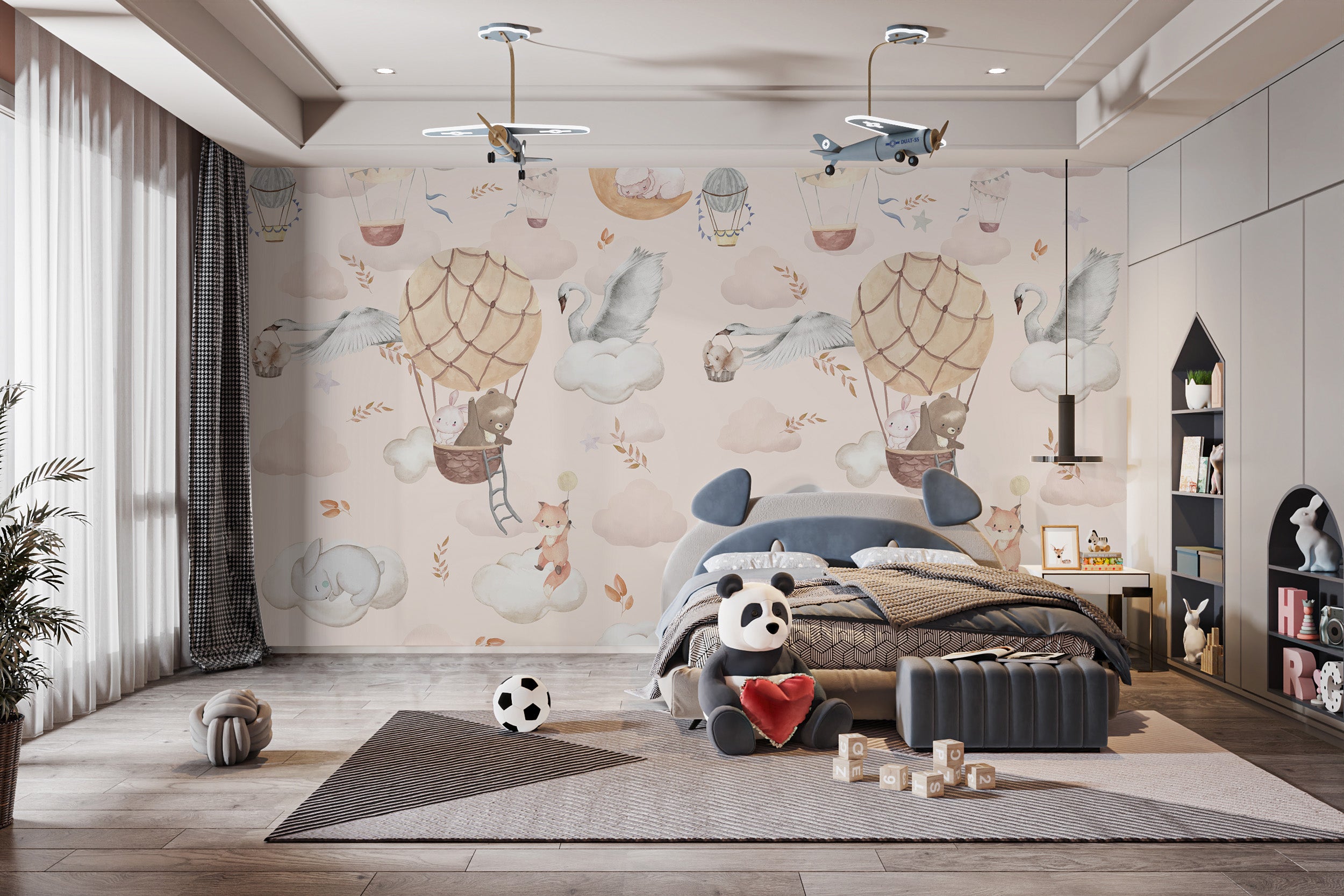 Nursery mural with flying animals design
