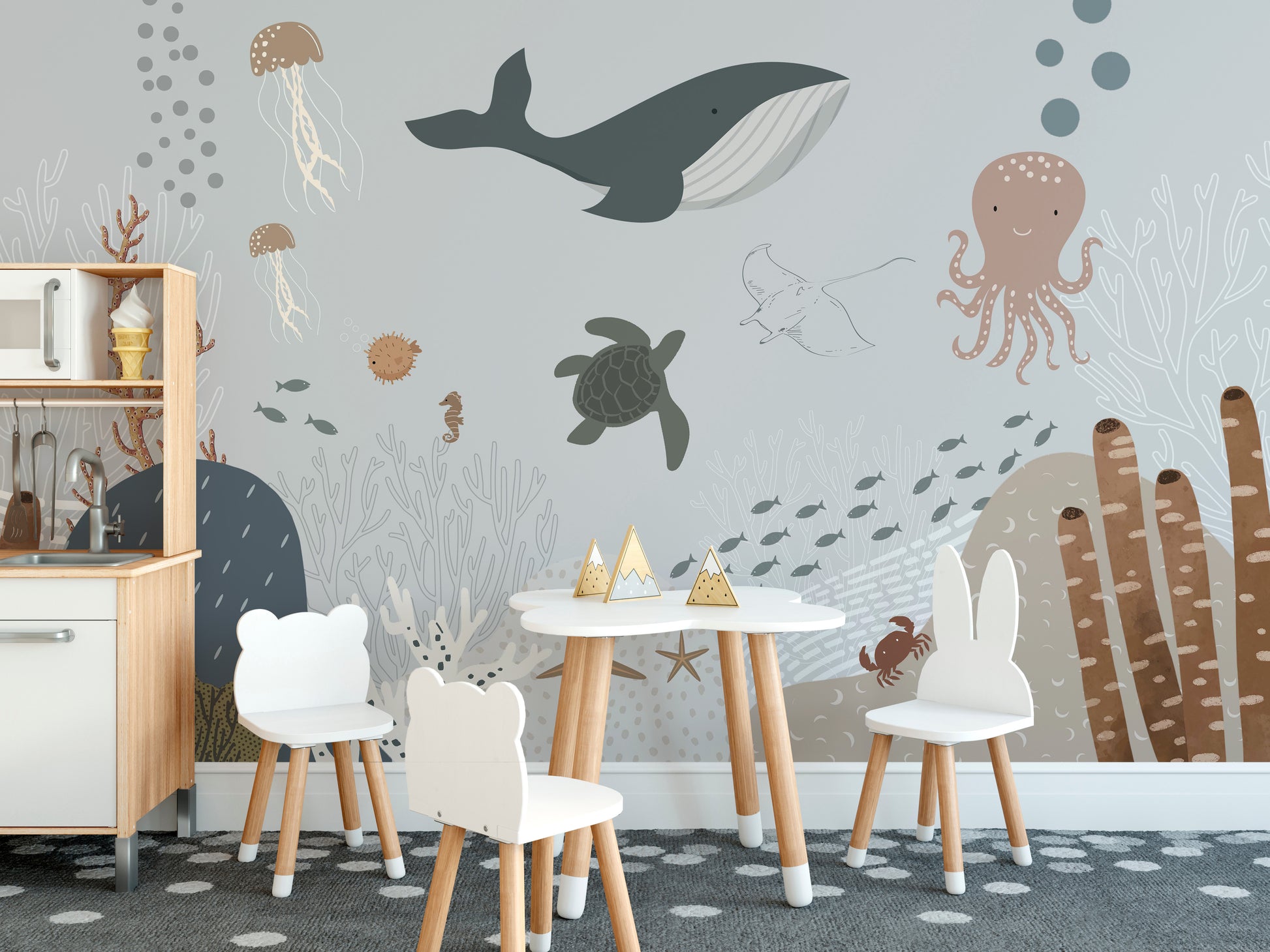 Whale family swimming in tranquil sea wallpaper.
