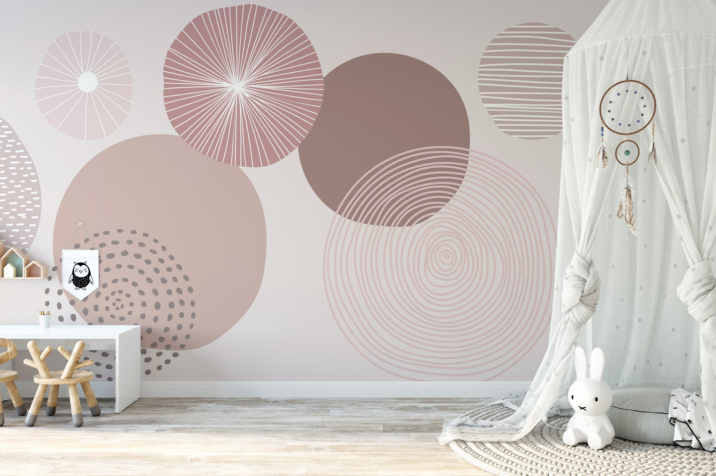 Dusky mauve abstract wallpaper blending subtle and bold circular shapes.