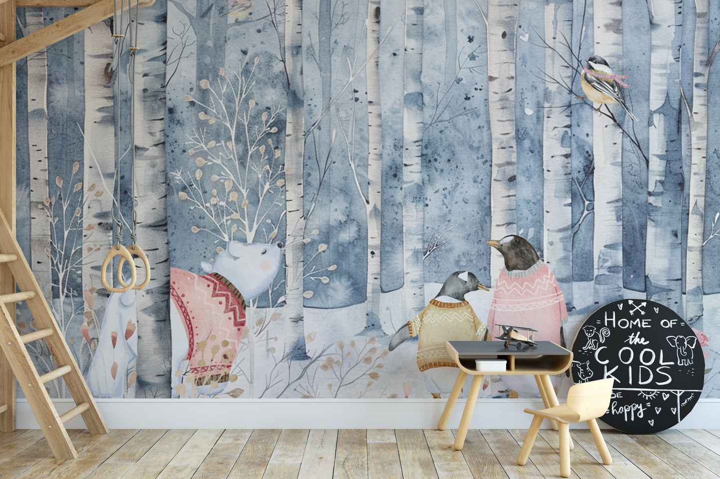 Winter woodland wallpaper with penguins in warm sweaters
